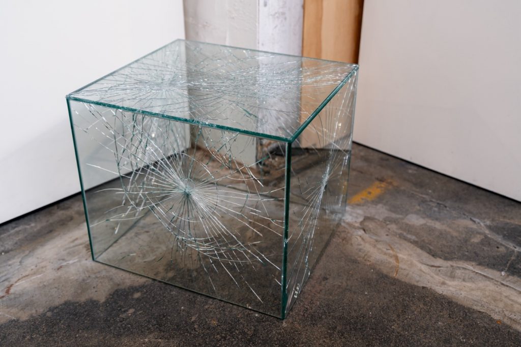 A shattered glass cube.